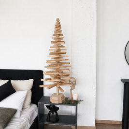 Handmade wooden Christmas tree with rotating branches and natural wood design