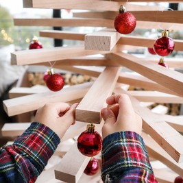 Handmade wooden Christmas tree with rotating branches and natural wood design
