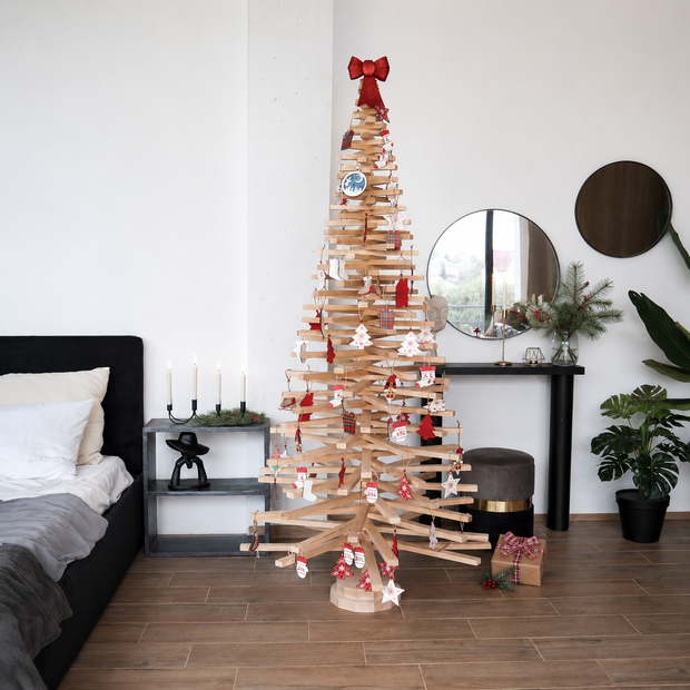 Handmade wooden Christmas tree with rotating branches and natural wood design