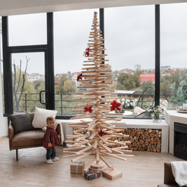 Handmade wooden Christmas tree with rotating branches and natural wood design