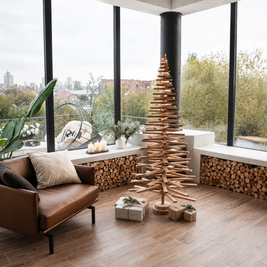 Handmade wooden Christmas tree with rotating branches and natural wood design