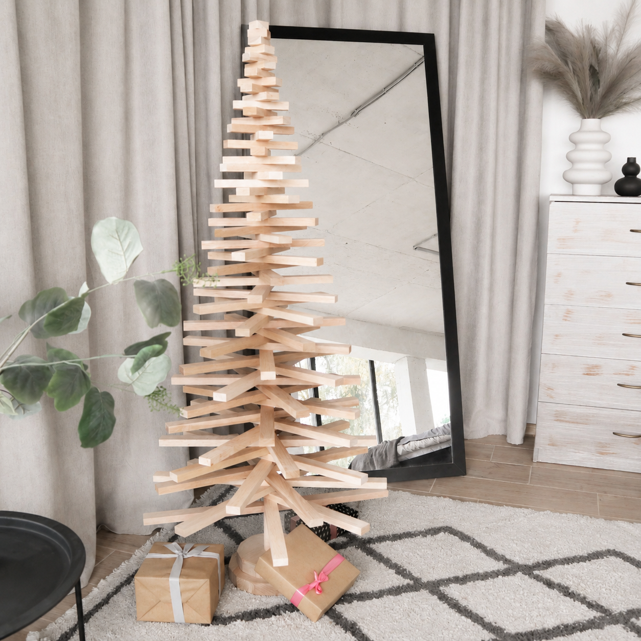 Handmade wooden Christmas tree with rotating branches and natural wood design