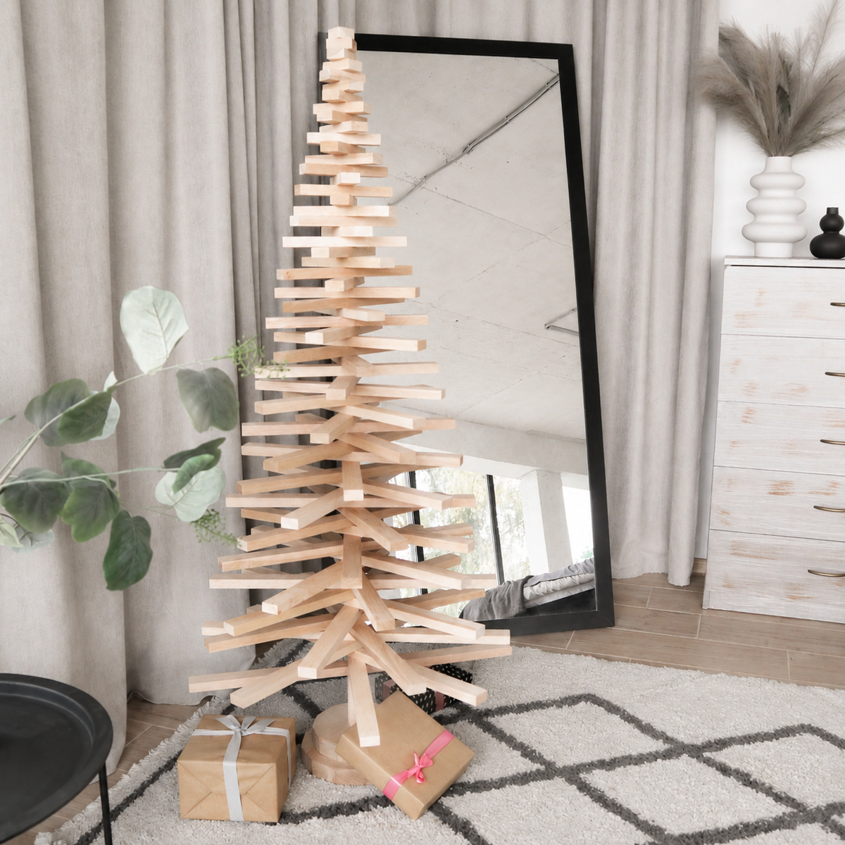 Handmade wooden Christmas tree with rotating branches and natural wood design