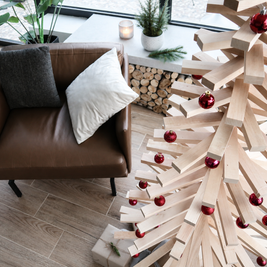 Handmade wooden Christmas tree with rotating branches and natural wood design