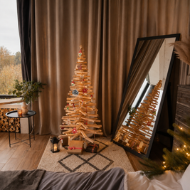 Handmade wooden Christmas tree with rotating branches and natural wood design