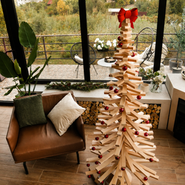 Handmade wooden Christmas tree with rotating branches and natural wood design