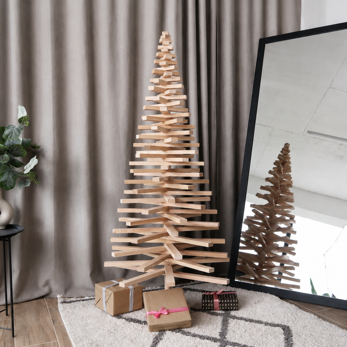 Handmade wooden Christmas tree with rotating branches and natural wood design