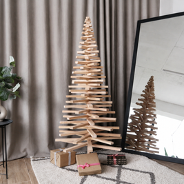 Handmade wooden Christmas tree with rotating branches and natural wood design