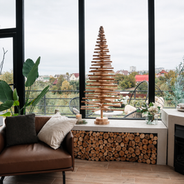 Handmade wooden Christmas tree with rotating branches and natural wood design