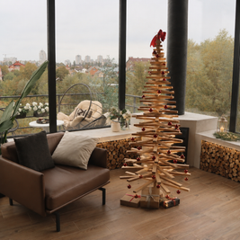 Handmade wooden Christmas tree with rotating branches and natural wood design