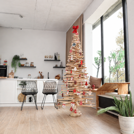 Handmade wooden Christmas tree with rotating branches and natural wood design