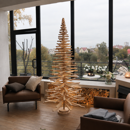 Handmade wooden Christmas tree with rotating branches and natural wood design