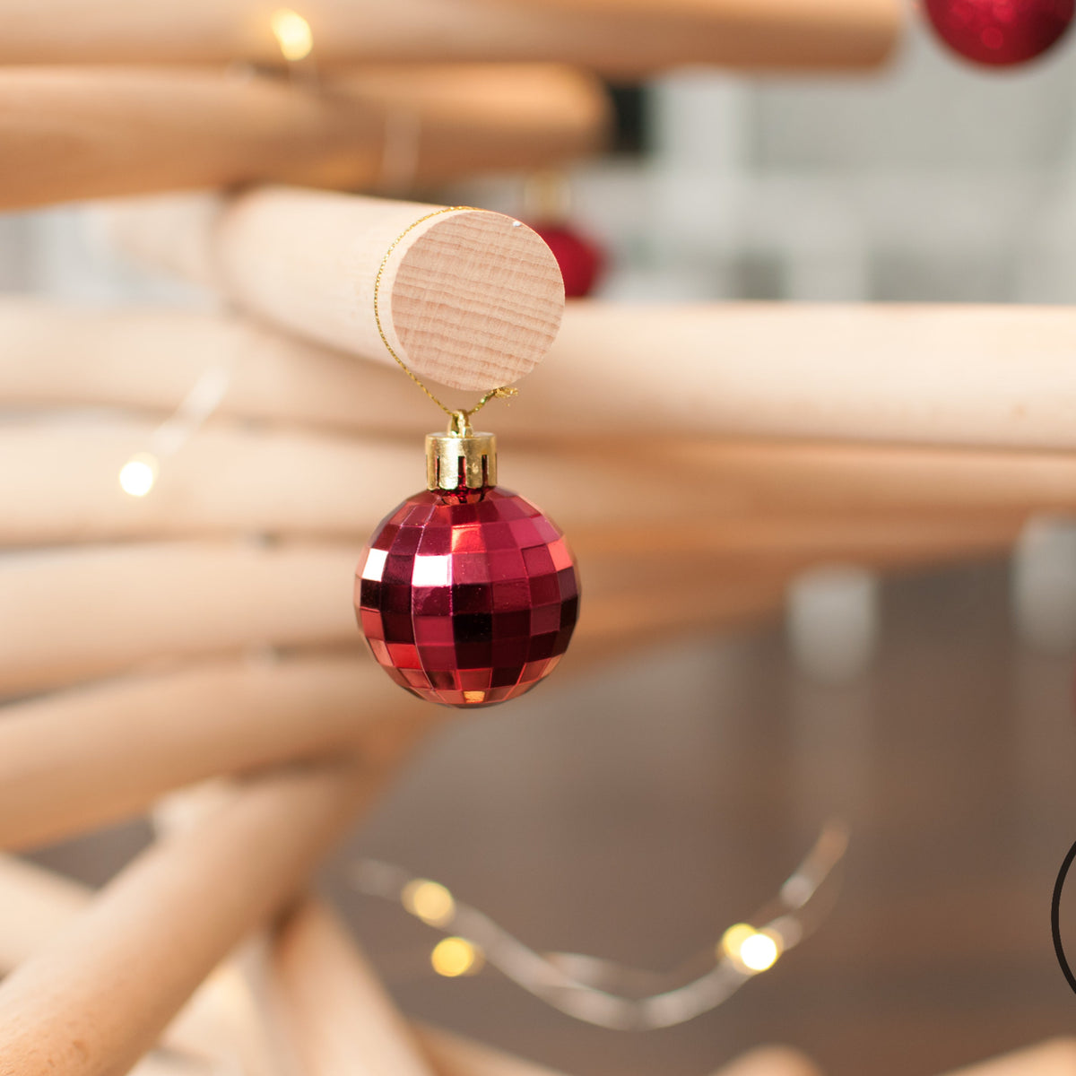 Handmade wooden Christmas tree with rotating branches in modern Scandinavian living room