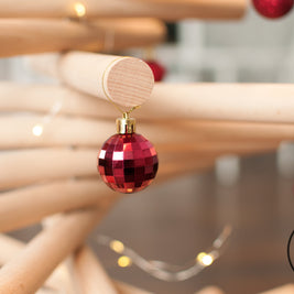 Handmade wooden Christmas tree with rotating branches in modern Scandinavian living room