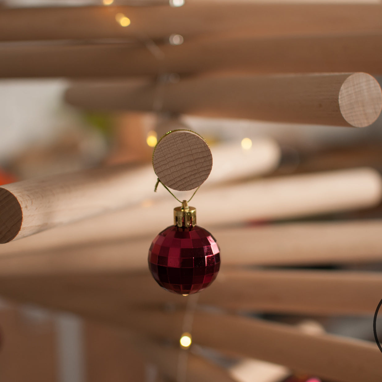 Handmade wooden Christmas tree with rotating branches and natural wood design