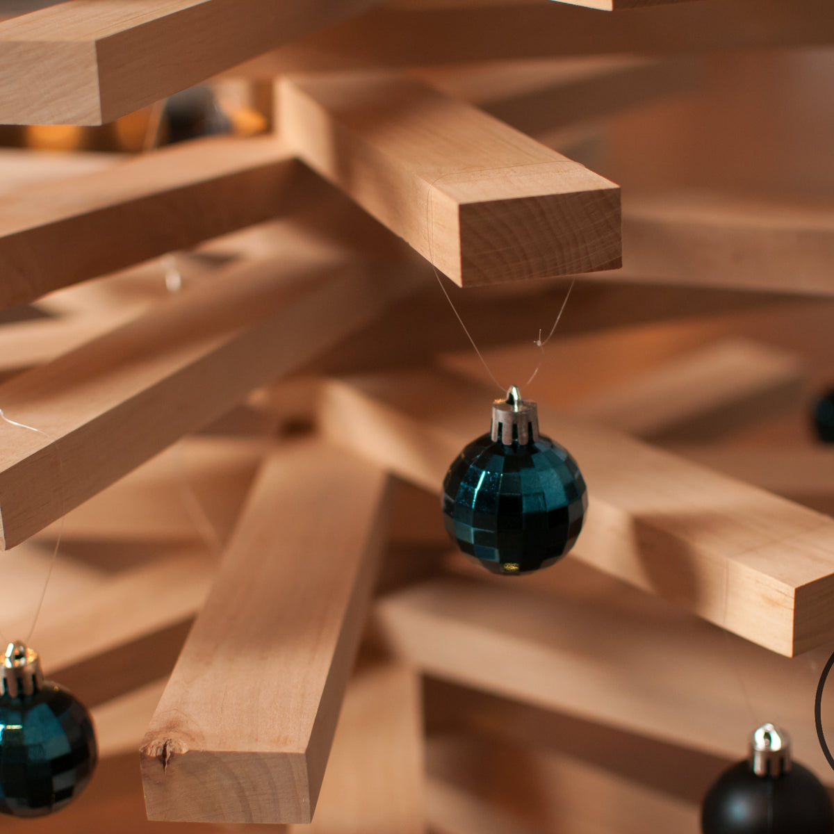 Handmade wooden Christmas tree with rotating branches in modern Scandinavian living room