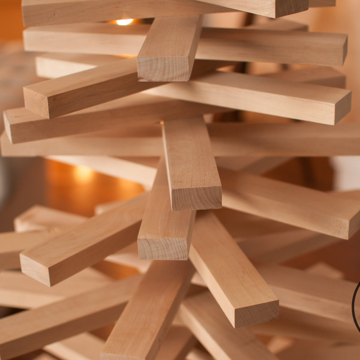 Handmade wooden Christmas tree with rotating branches in modern Scandinavian living room